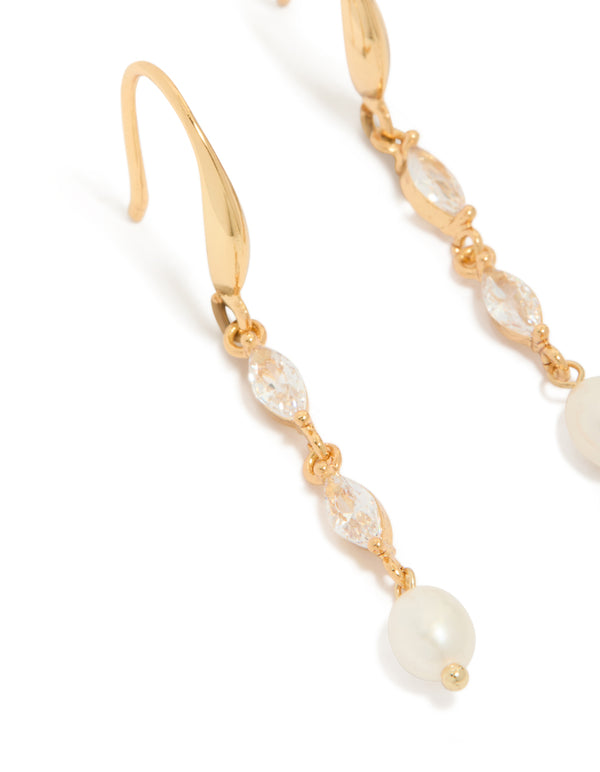 Highlighting the intricate cubic zirconia stones and freshwater pearl detail in gold plated hook drop earrings close up view