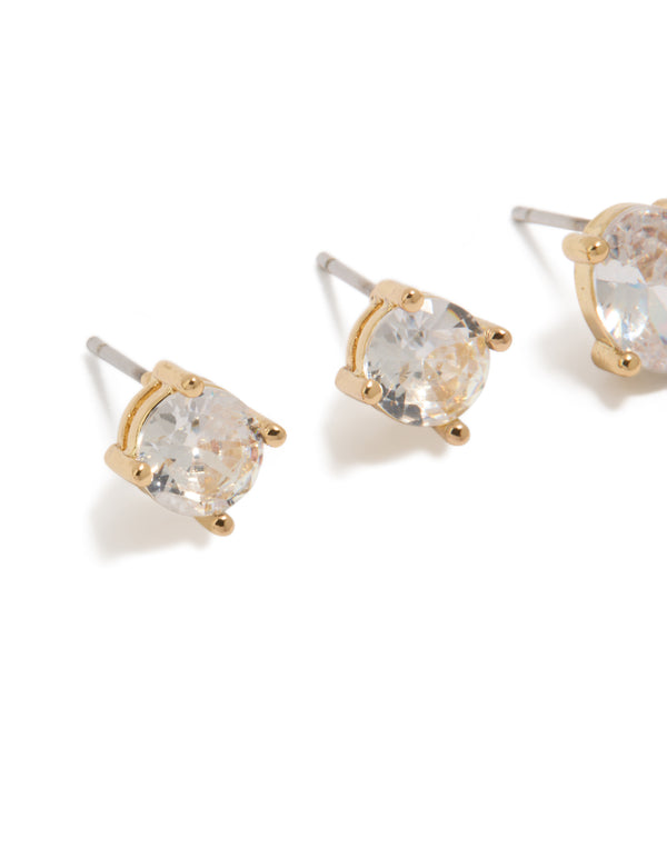 Showcasing gold plated round and oval cut cubic zirconia stud earrings in a dainty 2-pack with crystal features close up view