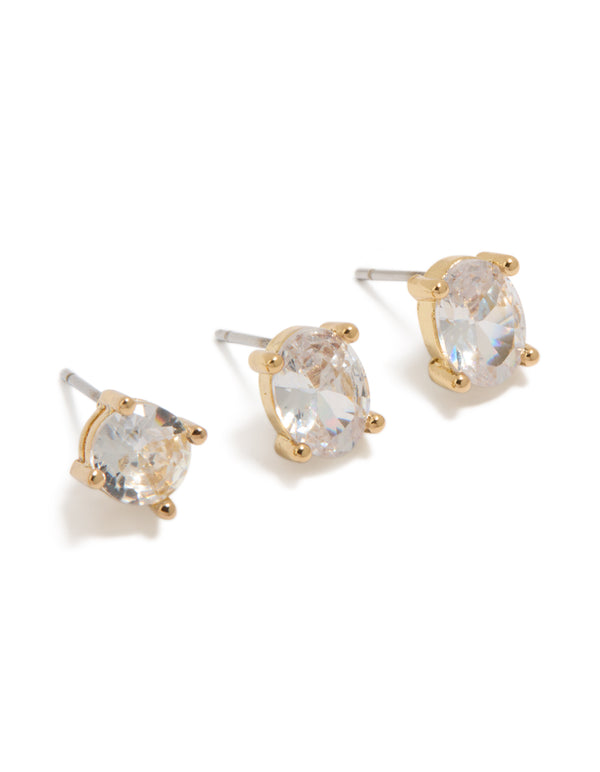 Showcasing gold plated round and oval cut cubic zirconia stud earrings in a dainty 2-pack with crystal features close up view