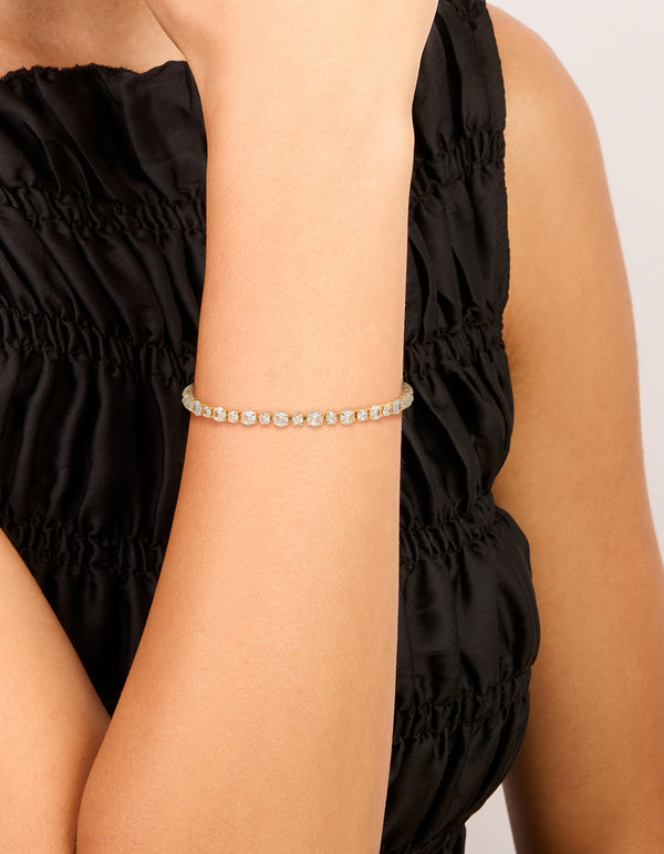 Featuring a gold plated large square cut cubic zirconia tennis bracelet on wrist view