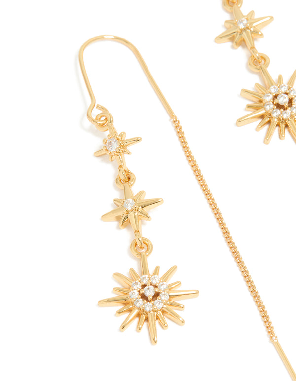 Beautifully detailed gold plated cubic zirconia stars thread through earrings featuring celestial close up view