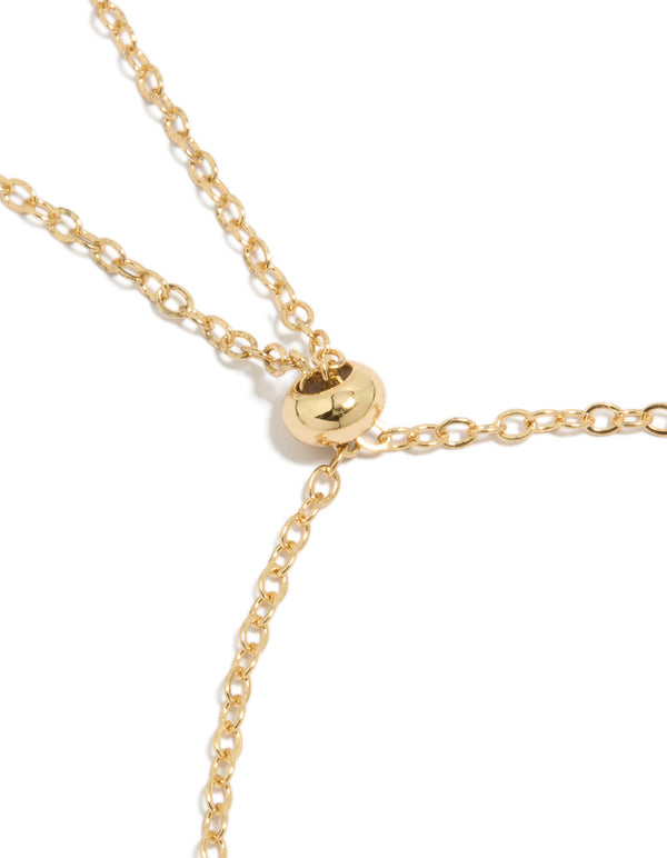 Featuring a gold plated clear and cognac cubic zirconia square cut bezel toggle bracelet closure detail view