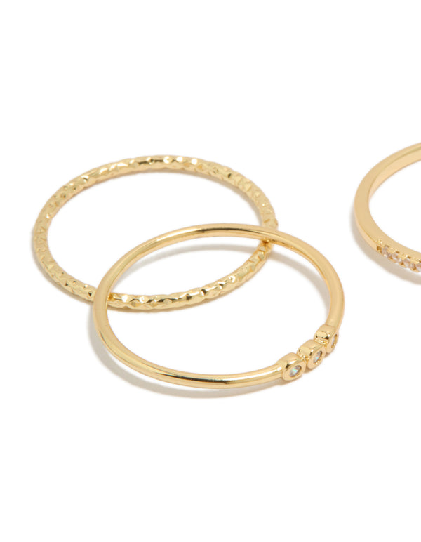Crafted from gold plated cubic zirconia square bezel and fine band rings 4-pack with stackable statement design close up view
