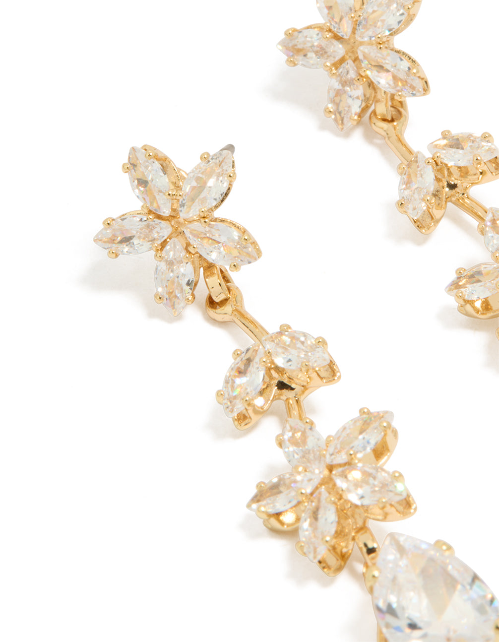 Presenting floral statement drop earrings with gold cubic zirconia stones close up view