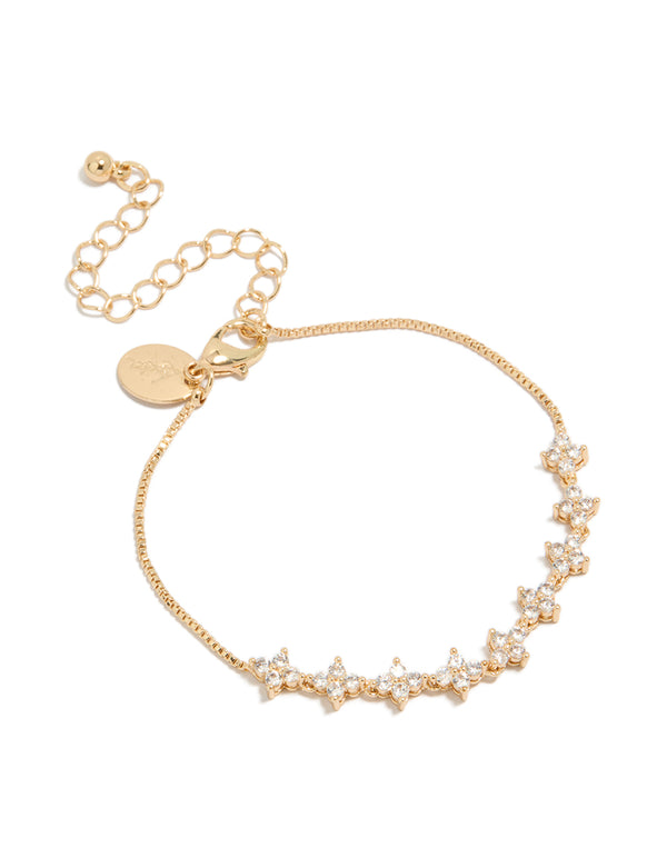 Showcasing a charm floral cubic zirconia bracelet in gold with a statement style front view