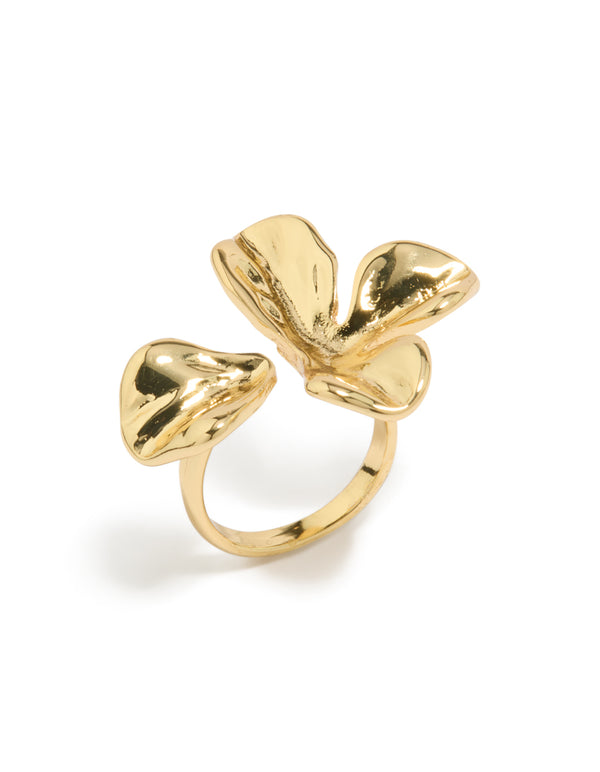 Displaying a statement gold plated molten floral wrap ring featuring sculptural band and wrap construction side detail view