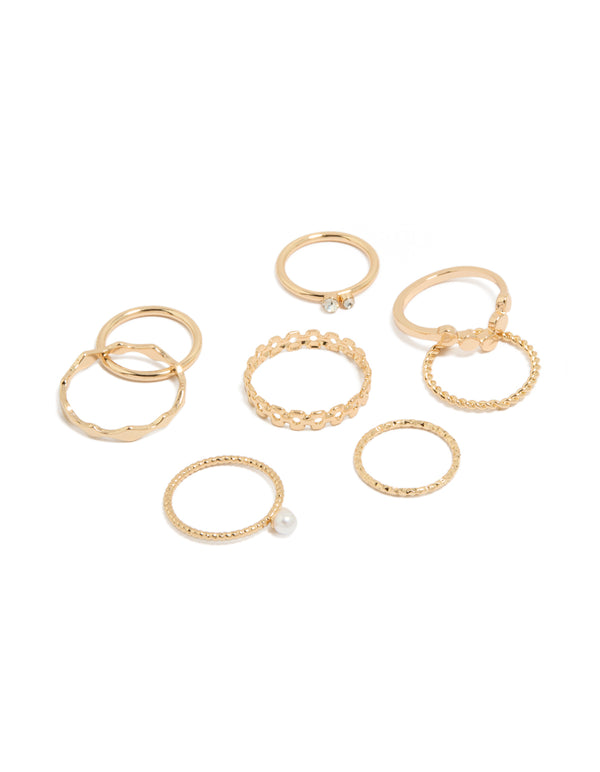 Showcasing gold pearl and thin mixed stacking rings in a statement 3-pack accents front view