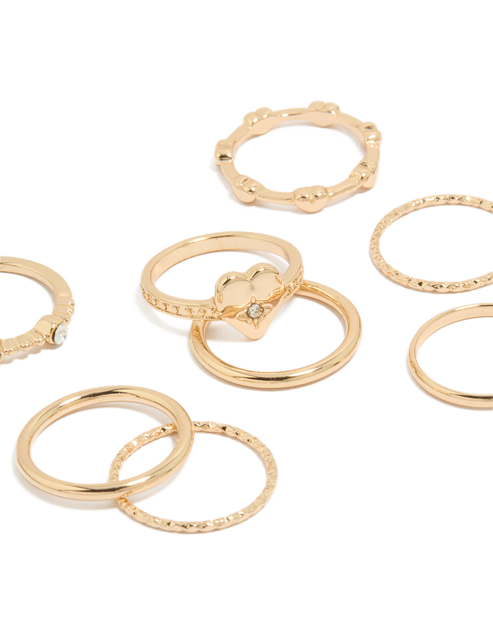 Featuring gold diamante heart band rings in an 8-pack close up view