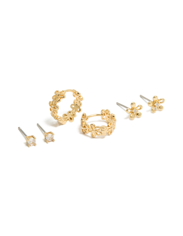 Showcasing gold plated cubic zirconia outline flower studs and huggie earrings in a dainty 3-pack front view