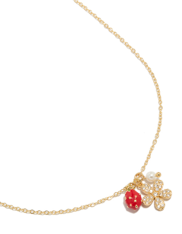Showcasing a delicate charm necklace featuring strawberry fruit, pearl, and flower pendants with crystal and cubic zirconia details, close up view