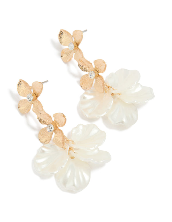 Showcasing statement floral drop earrings with ivory petal accents in gold front view