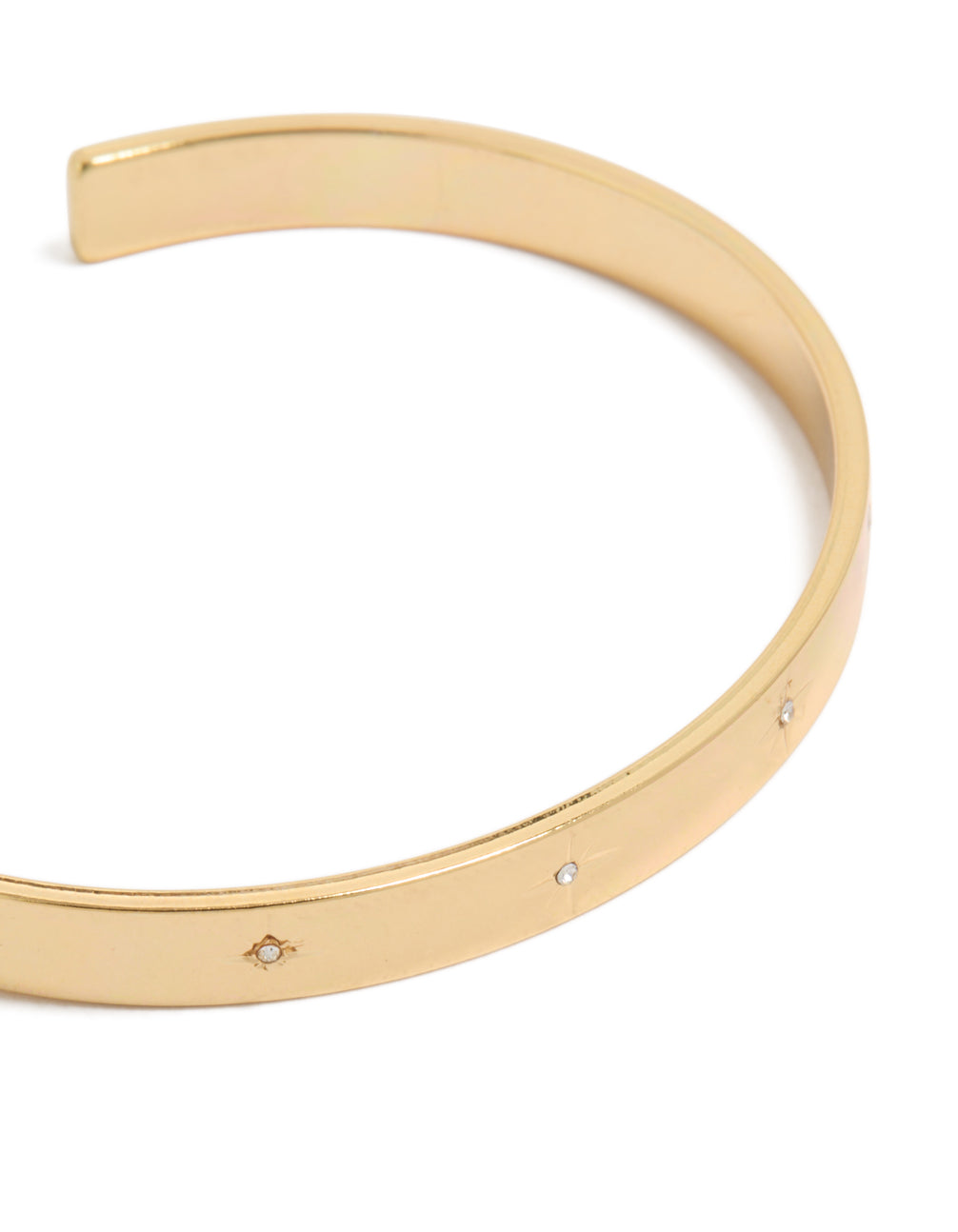 Elegant celestial star diamante wrist cuff in gold plated finish close up view