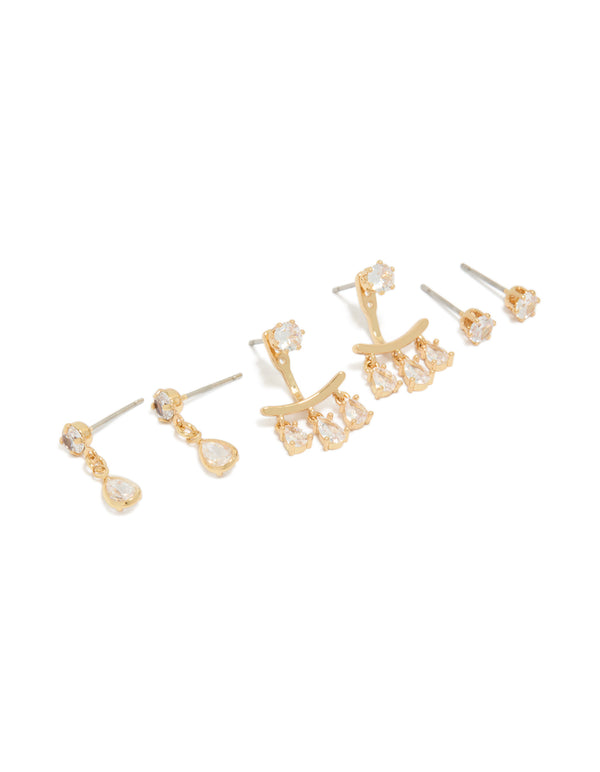 Showcasing dainty stud earrings in a 3-pack featuring pear cut cubic zirconia with gold plated ear jacket closures front view