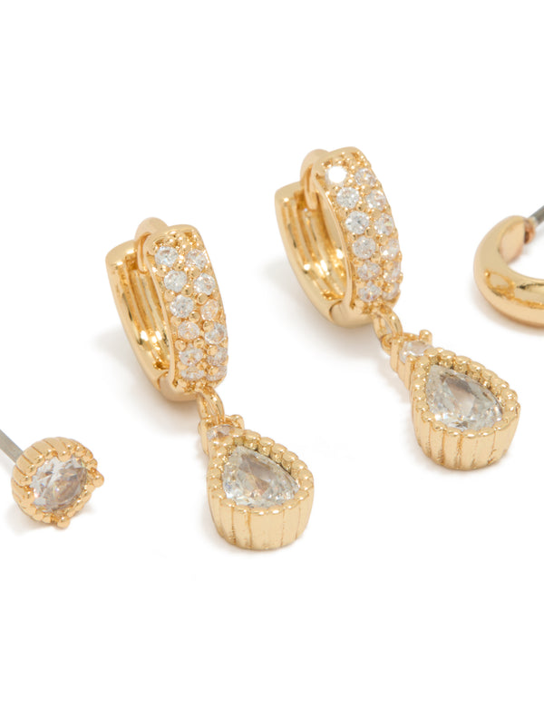 Crafted from gold plated cubic zirconia featuring pear cut stones with huggie and stud closures in a 3-pack close up view
