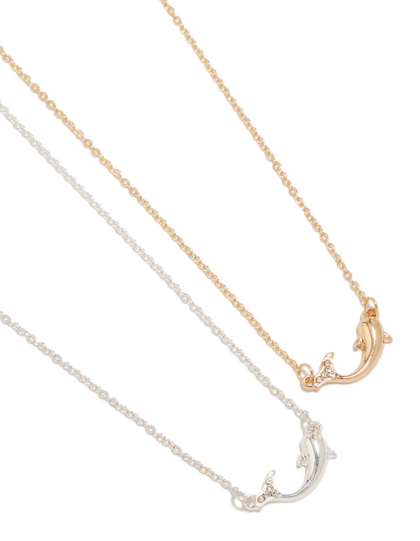 Showcasing mixed metal diamante dolphin necklaces in a 2-pack featuring ocean details with gold and silver tones close up view