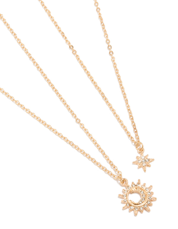 Featuring gold diamante celestial necklaces in a 2-pack with pendant, star, sun details in statement style close up view