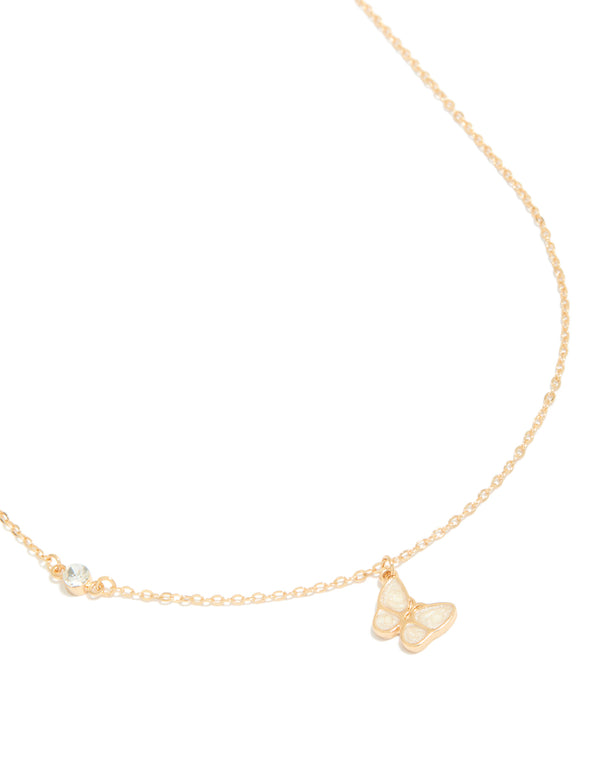 Featuring a diamante and butterfly pendant necklace in gold close up view