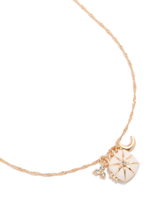 Discover a celestial charm locket necklace featuring moon and star accents in gold close up view