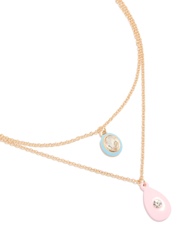 Showcasing a gold acrylic and diamante pendant layered necklace close up view