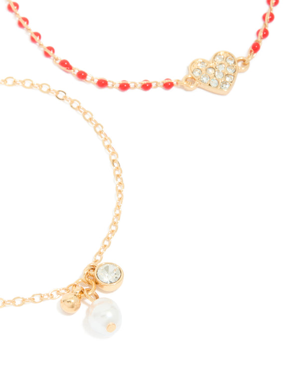 Featuring gold red beaded diamante heart and pearl bracelets in a 2-pack with charm accents close up view