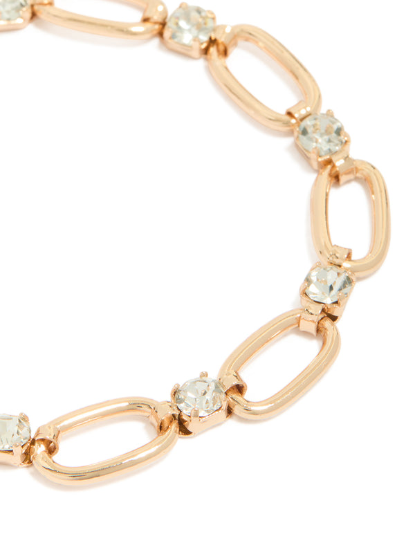Featuring a gold oval chain bracelet with diamante details close up view