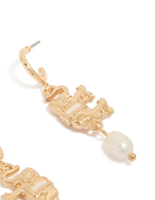 Designed gold hoop earrings featuring a freshwater pearl and an animal elephant charm with ivory accents post detail view