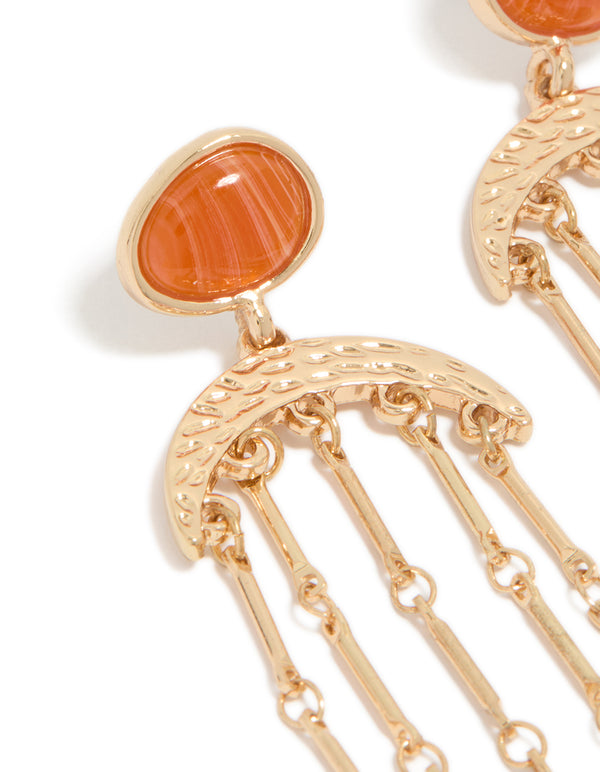 Featuring statement style, these gold cat eye stone drop earrings showcase beads accents, and charm details in coral and orange close up view
