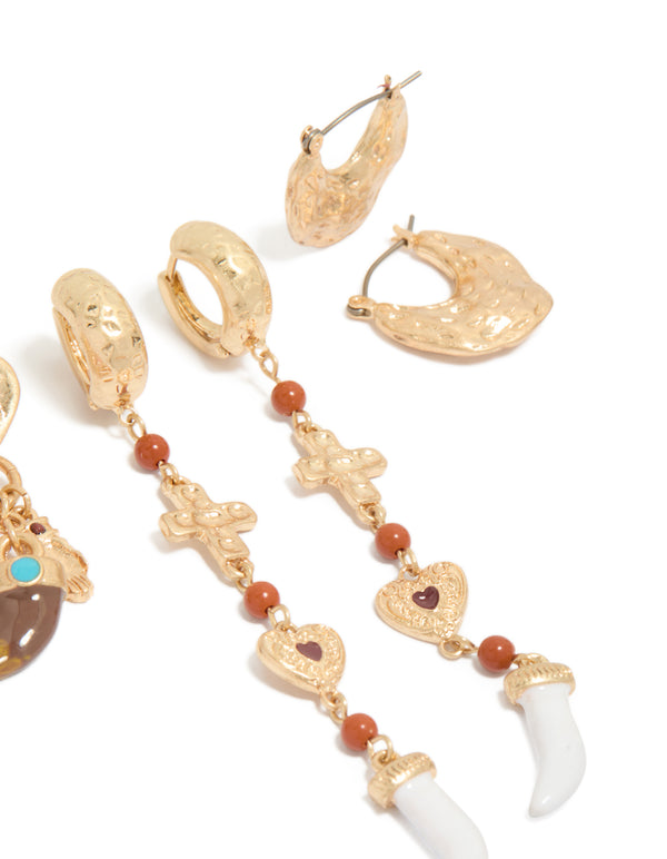 Designed with worn gold statement earrings 3-pack featuring beads, charm, cross, heart, and stud, huggie closure post detail view