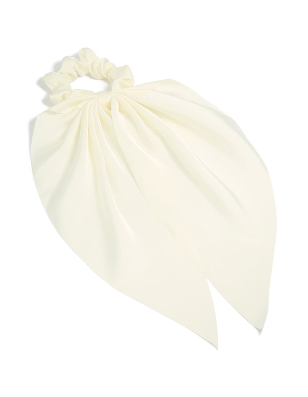 Crafted from solid ivory fabric, this simple cream long scarf scrunchie front view