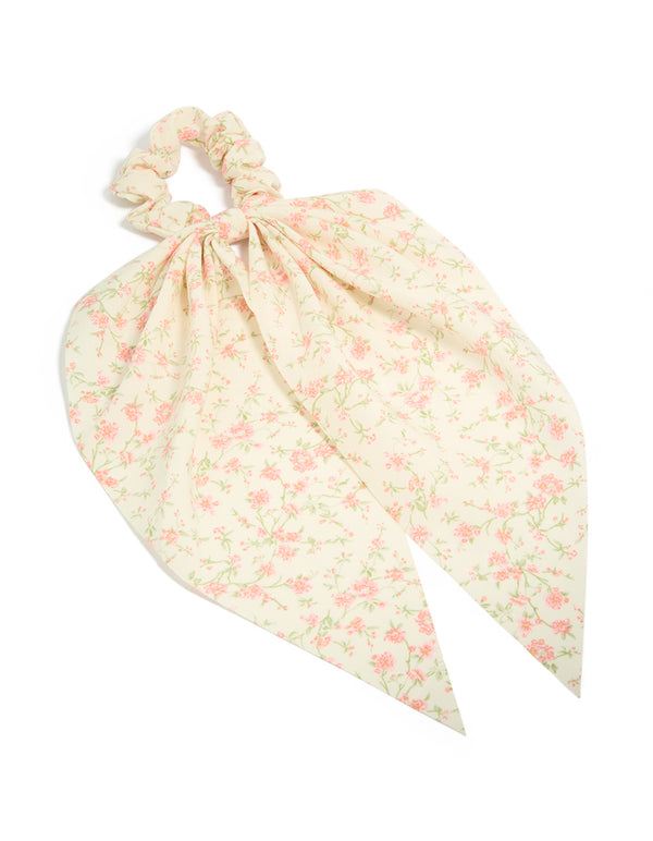 Showcasing a pretty pink flower printed scarf scrunchie featuring leaf and floral pattern in cornsilk, light pink, and pale green front view