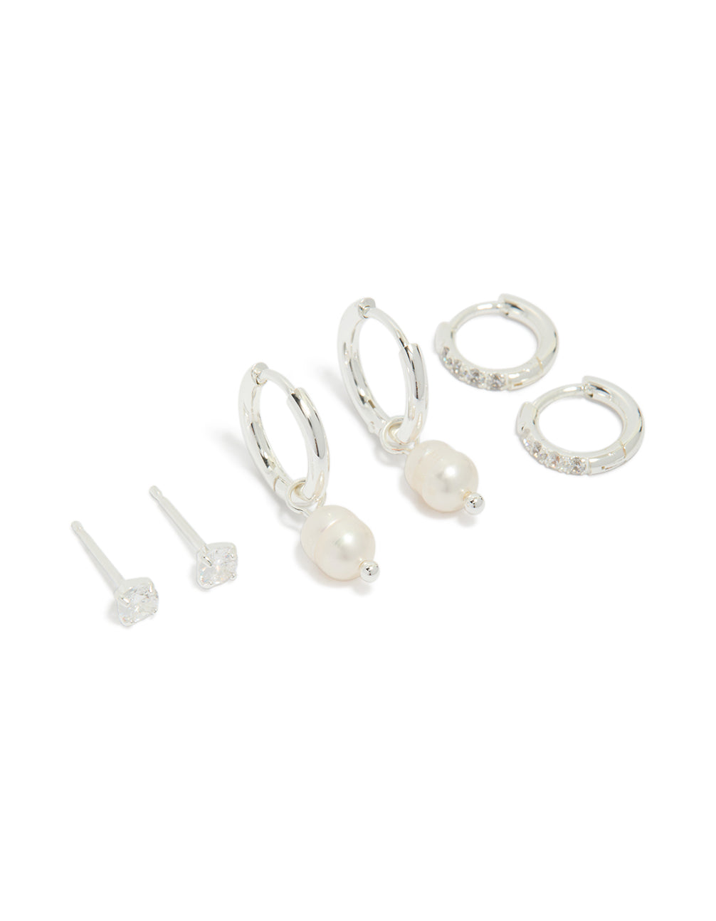 Showcasing a stainless steel cubic zirconia and freshwater pearl huggie and stud earrings pack featuring crystal in waterproof silver and ivory front view