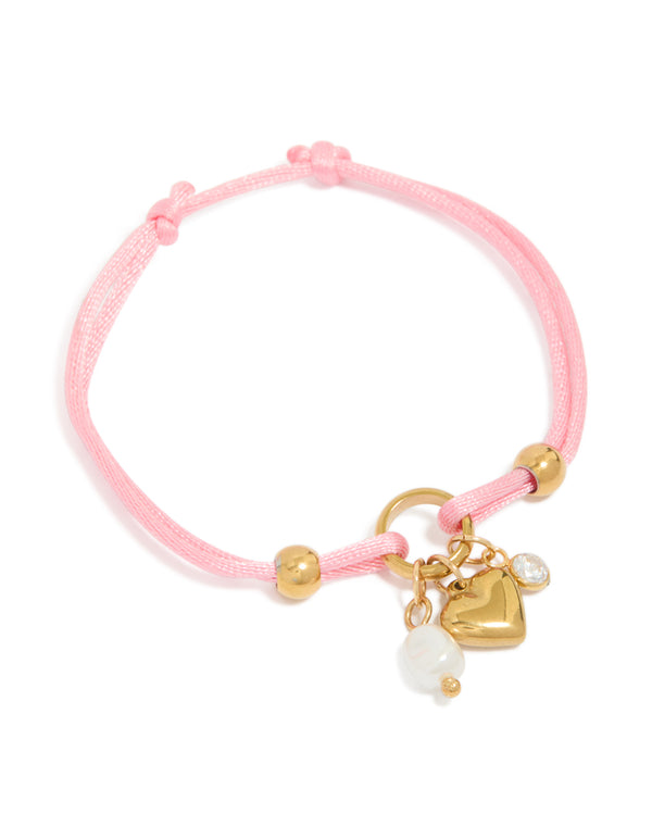 Beautifully designed pink cord bracelet with beads, charm, heart, pearl, cubic zirconia, gold plated stainless steel, round stone, waterproof, white accents front view