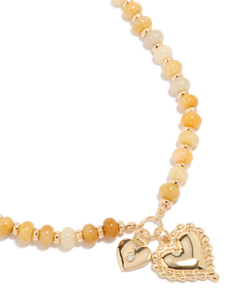 Showcasing a gold semi precious stone beaded duo heart necklace with charm feature close up view