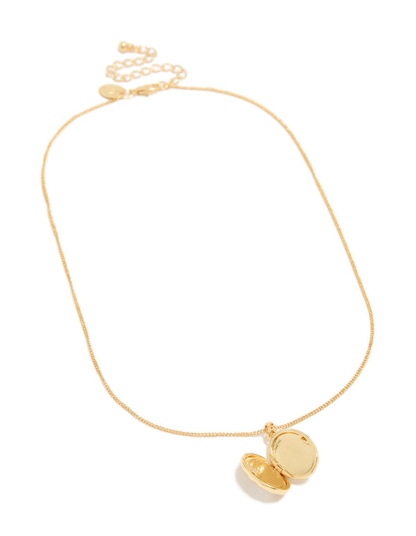 A gold plated shell Mary locket necklace with ocean pendant front view