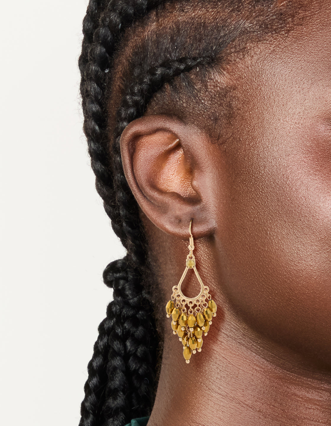 Crafted from gold with irregular beaded drop earrings featuring charm details on ear view