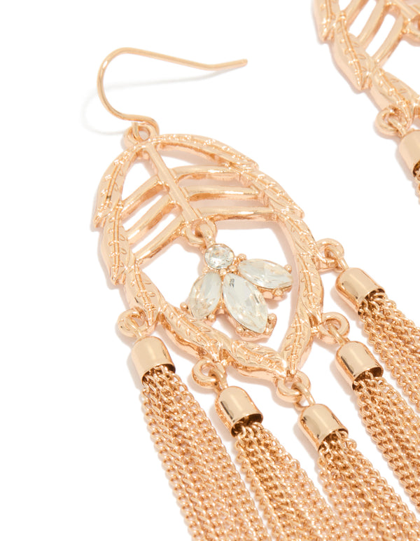 Beautifully crafted statement gold leaf diamante tassel drop earrings close up view