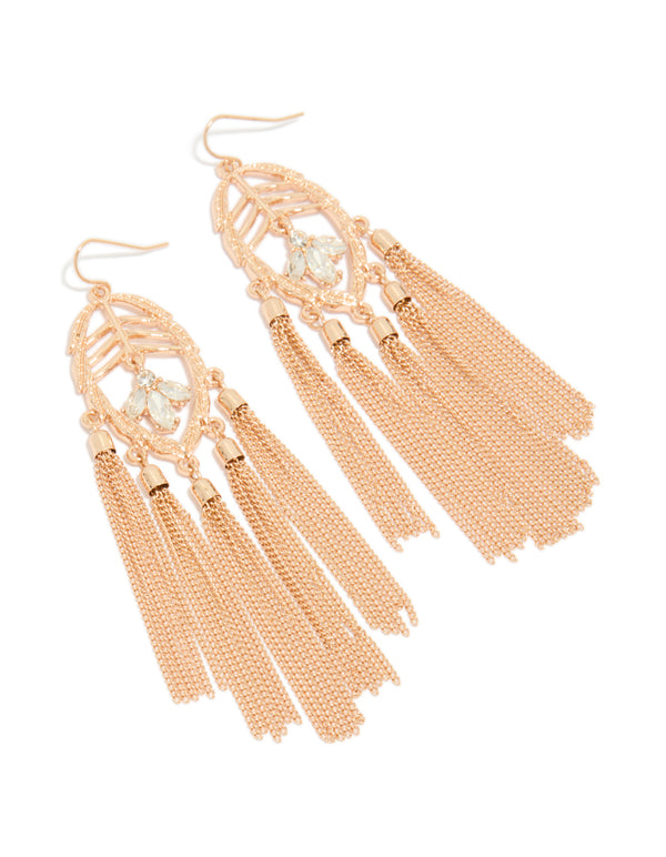 Elegant gold and diamante statement earrings featuring leaf accents and tassel drops front view