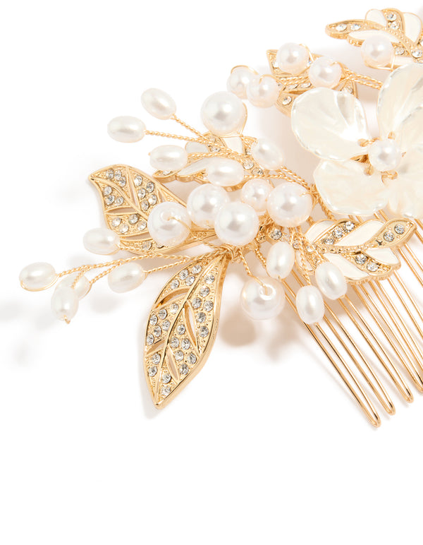 Stunning floral hair comb featuring leaf and pearl details with ivory petals in gold side view
