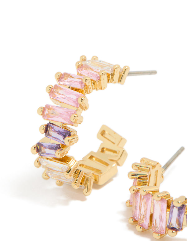Featuring statement hoop earrings with baguette cut cubic zirconia in pink purple and lavender gold plated close up view