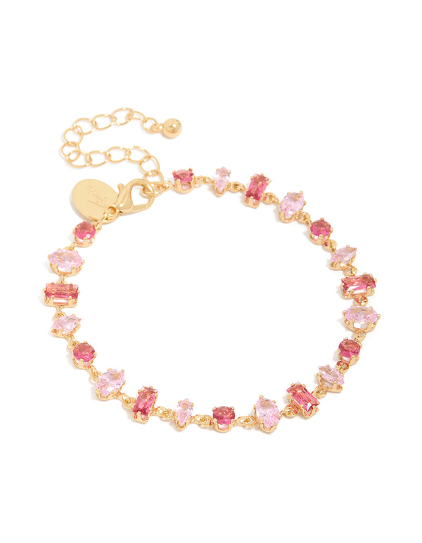 Showcasing a gold large pink multi-cut cubic zirconia tennis bracelet front view