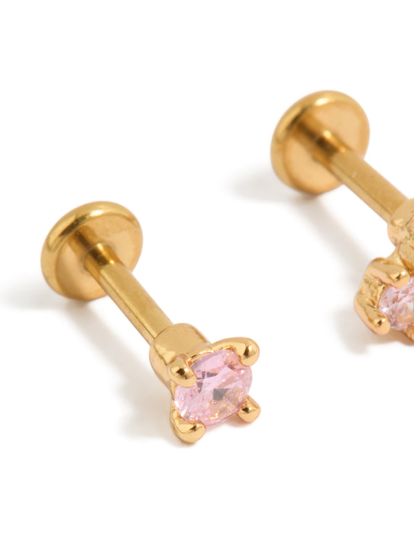Showcasing gold plated titanium pink cubic zirconia flat back studs with crystal in light pink close up view