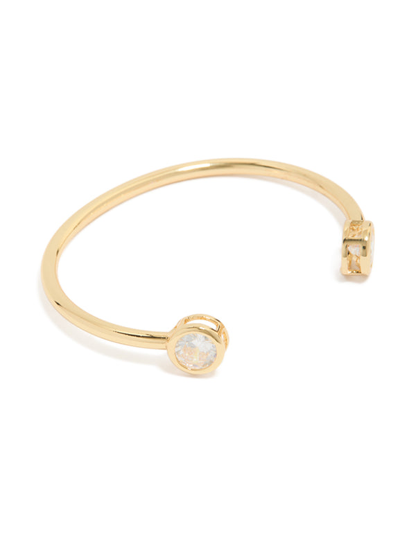 Showcasing a gold plated cubic zirconia open wrist cuff in clear front view