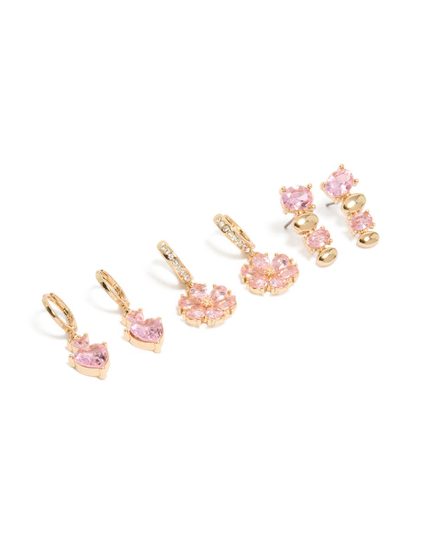 Showcasing gold pink diamante flower and heart huggie earrings in a 3-pack set with floral details featuring oval stone cut and clear accents front view