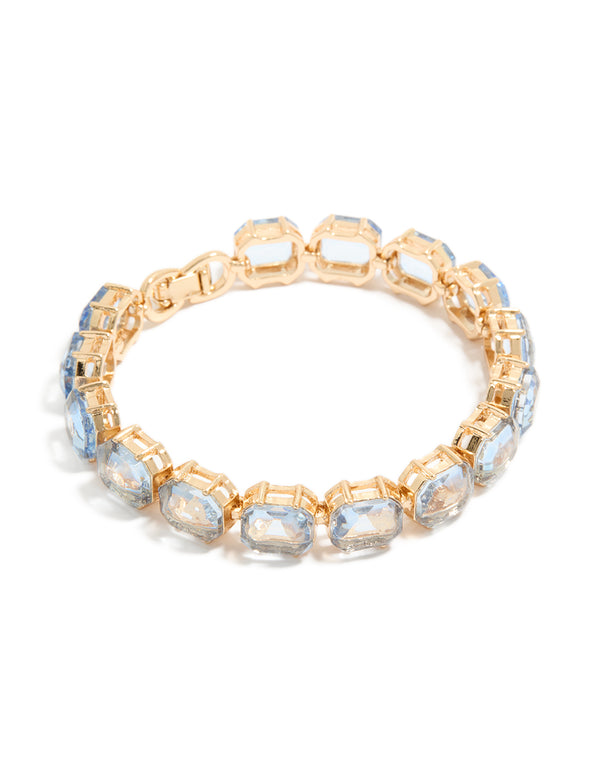 Showcasing a gold large light blue diamantes bracelet in front view