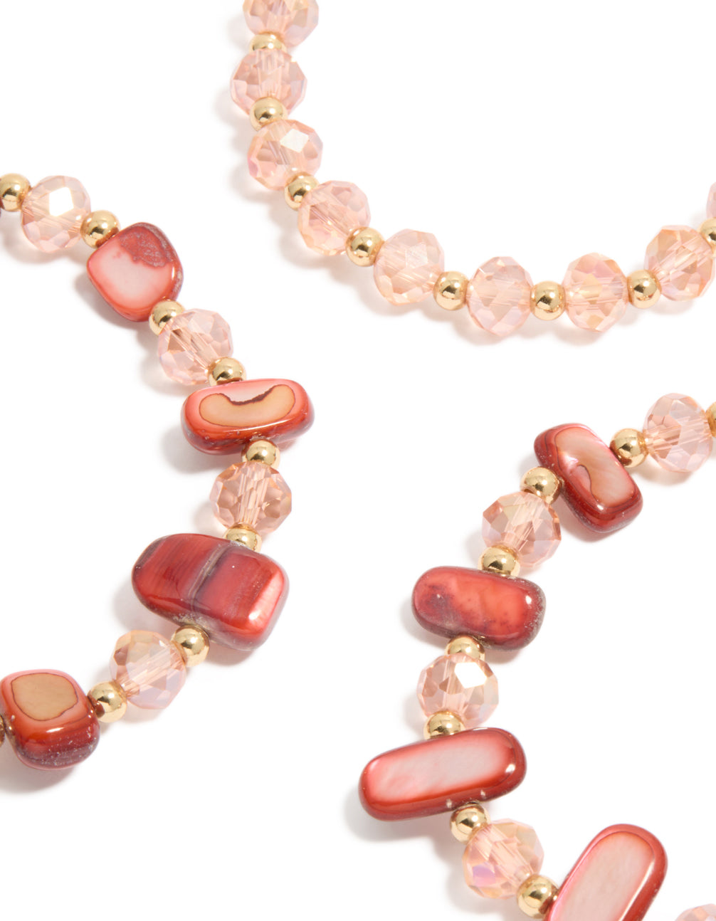 Discover beaded stretch bracelets with shell accents in light coral, light pink, and gold as a 3-pack close up view