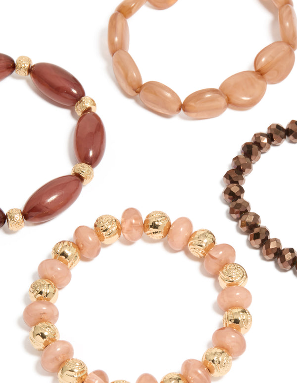 Displaying beaded stretch bracelets in pink and brown close up view