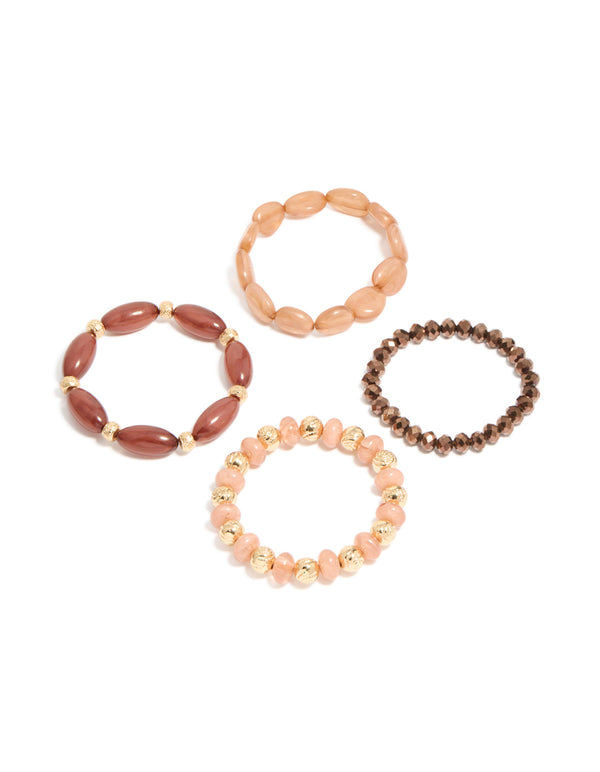 Showcasing a 4-pack of pink and brown beaded stretch bracelets in gold front view
