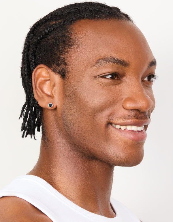 Presenting waterproof black coated stainless steel round flat back studs in silver on model view