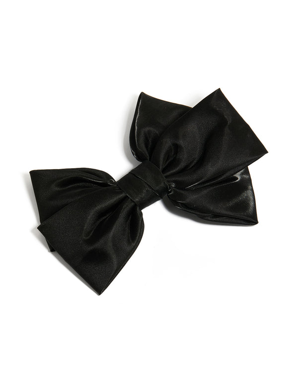Elegant bow clip featuring solid print in shiny black with statement styling front view