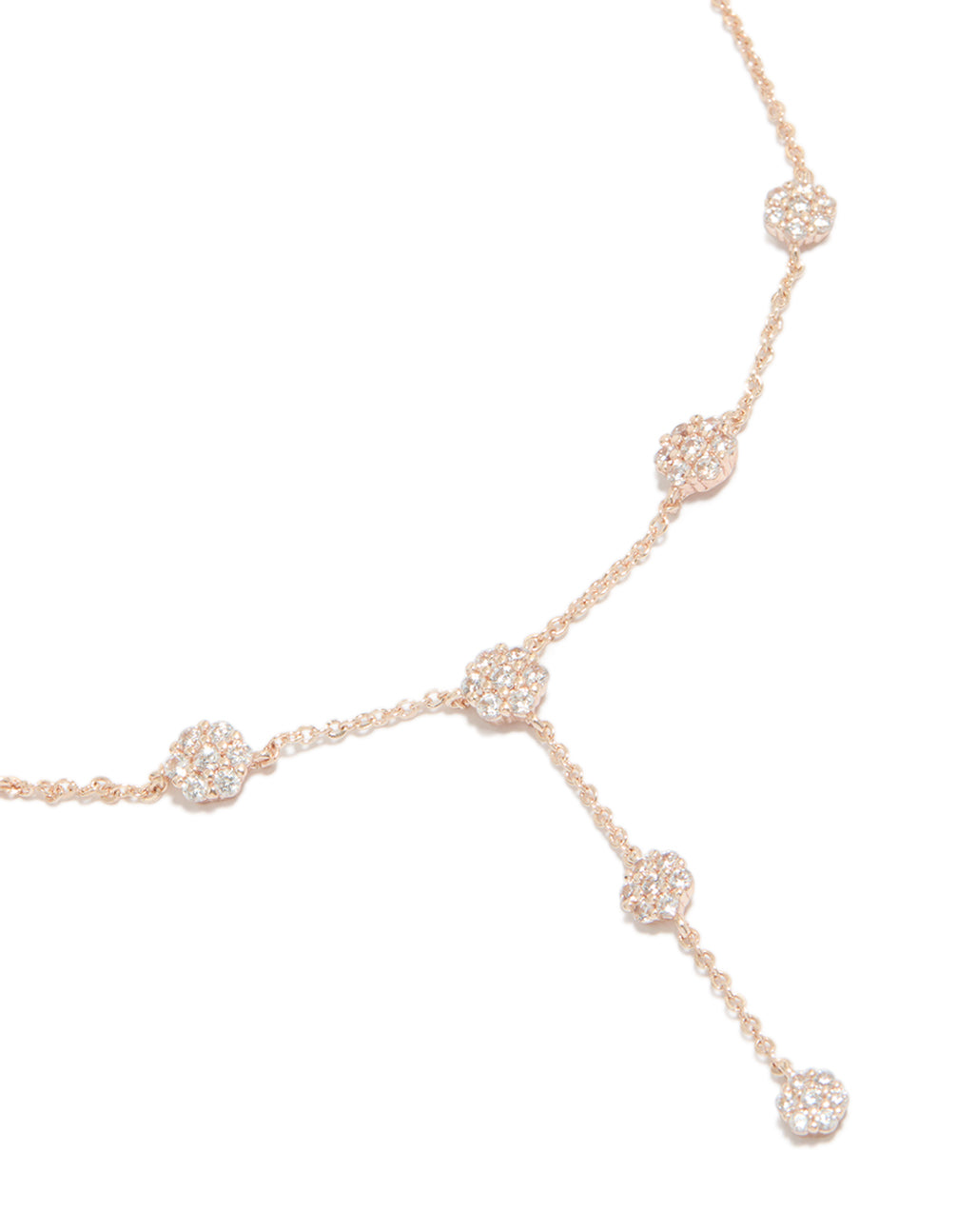 Showcasing a rose gold cubic zirconia mini floral Y-necklace with dainty detailing, close up view